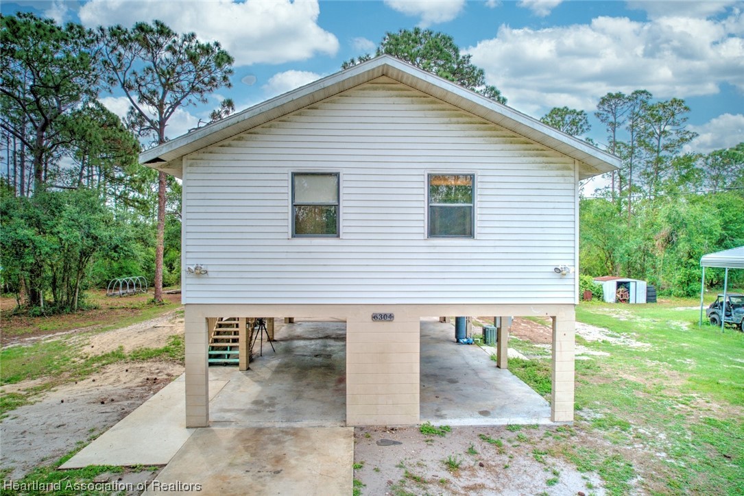 6304 Gunner Terrace Sebring, FL 33875 - Photo 11 of 41 a view of a house with backyard
