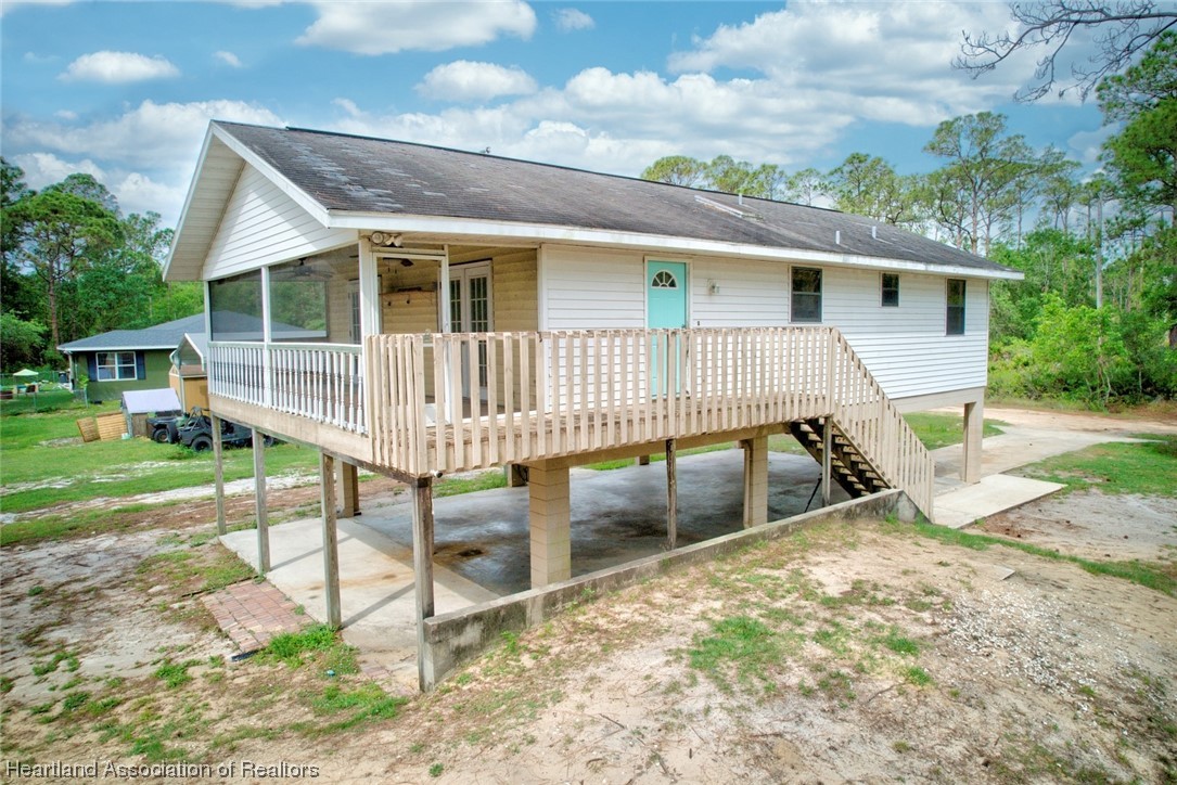 6304 Gunner Terrace Sebring, FL 33875 - Photo 14 of 41 front view of a house with a yard