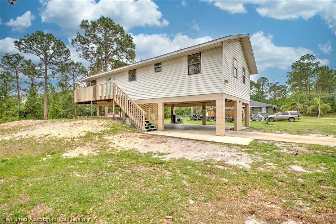6304 Gunner Terrace Sebring, FL 33875 - Photo 17 of 41 a view of house with a yard
