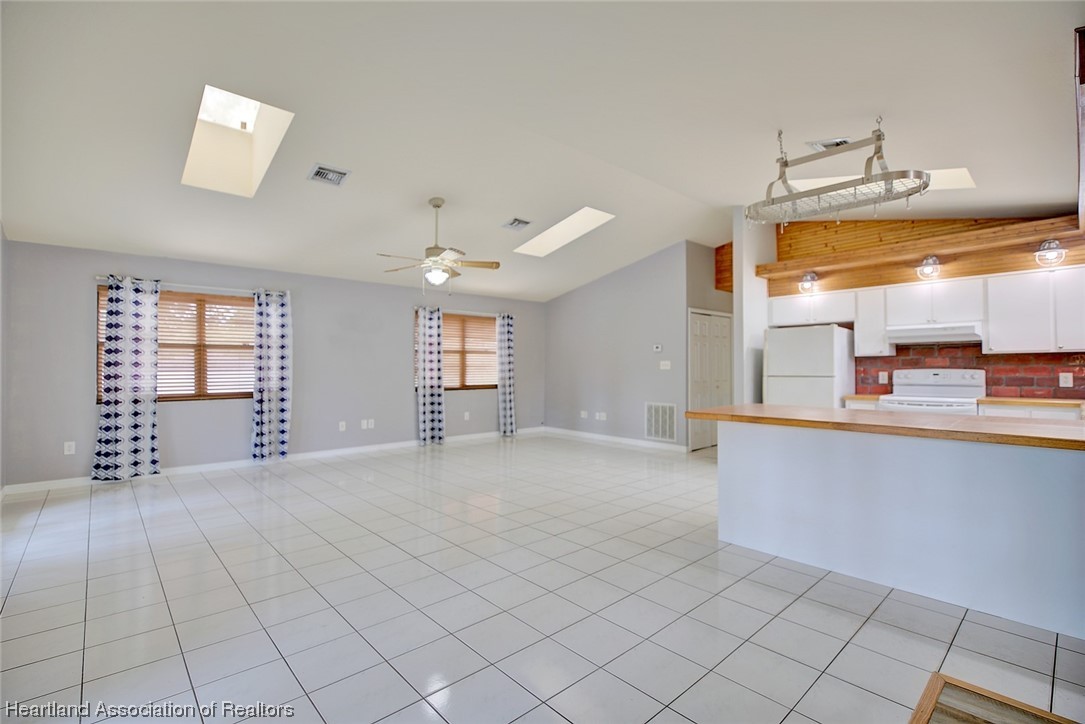 6304 Gunner Terrace Sebring, FL 33875 - Photo 18 of 41 a view of an empty room and window