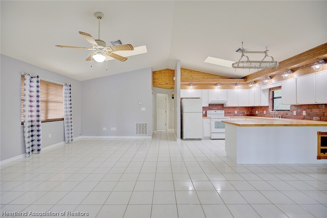 6304 Gunner Terrace Sebring, FL 33875 - Photo 19 of 41 a view of a kitchen with cabinet and stainless steel appliances