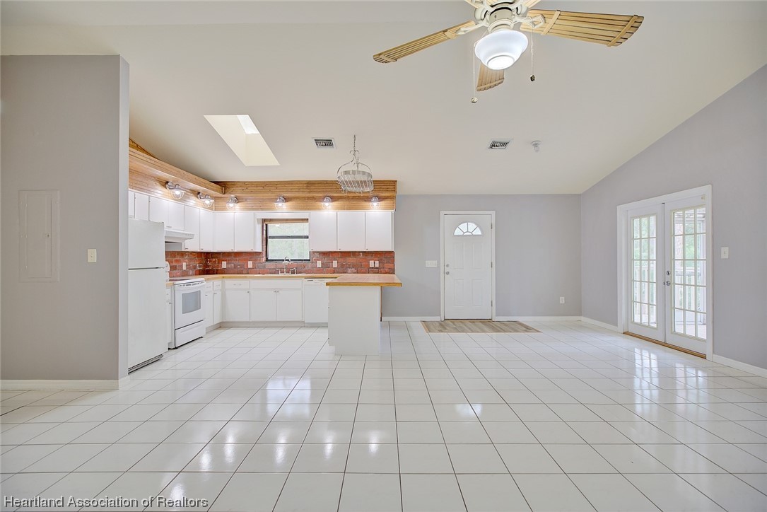 6304 Gunner Terrace Sebring, FL 33875 - Photo 21 of 41 a view of a kitchen with a sink and cabinets