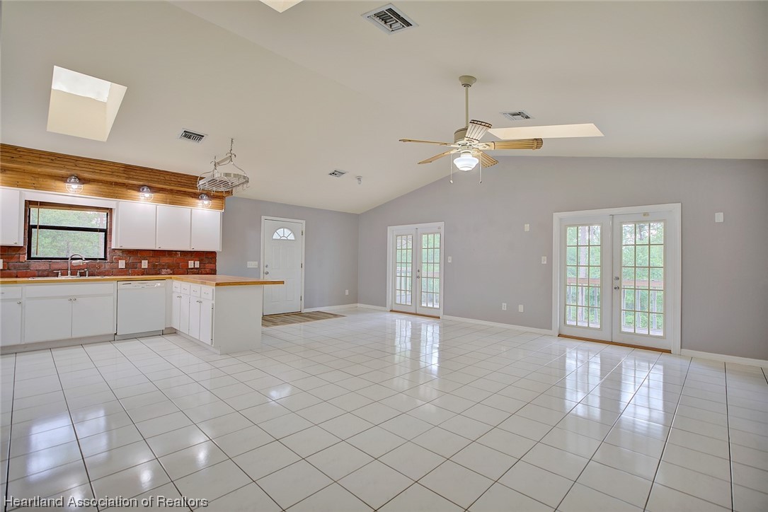 6304 Gunner Terrace Sebring, FL 33875 - Photo 22 of 41 a view of a kitchen with cabinet and a fireplace