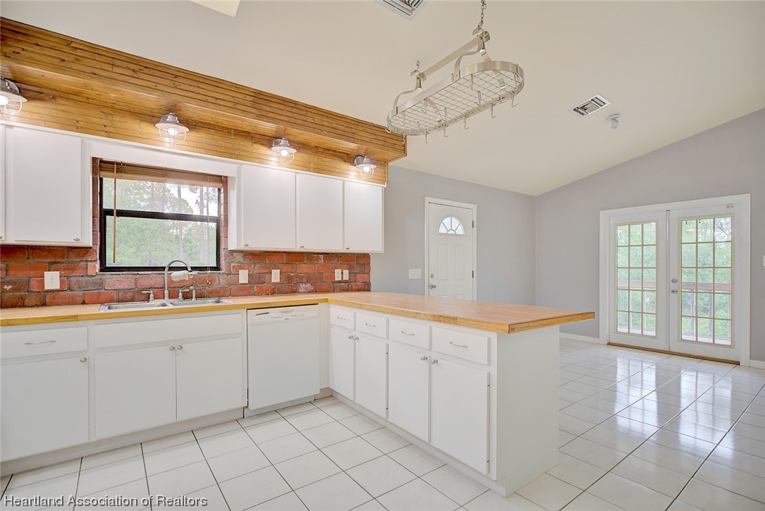 6304 Gunner Terrace Sebring, FL 33875 - Photo 3 of 41 a view of a kitchen with a sink and cabinets