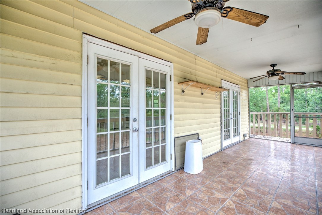 6304 Gunner Terrace Sebring, FL 33875 - Photo 31 of 41 a view of an entryway with a house
