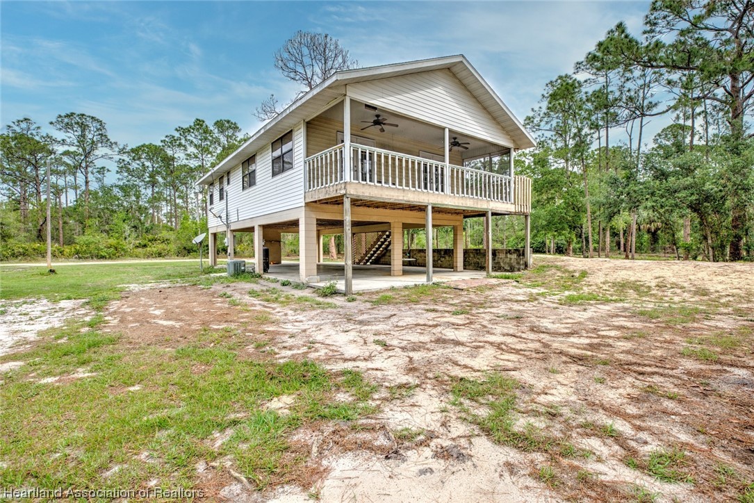 6304 Gunner Terrace Sebring, FL 33875 - Photo 36 of 41 a front view of a house with a yard