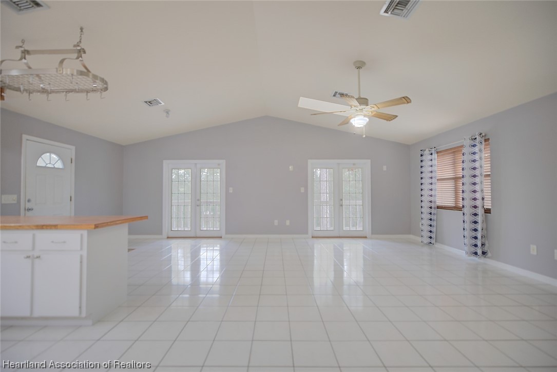 6304 Gunner Terrace Sebring, FL 33875 - Photo 4 of 41 a view of an empty room with a window