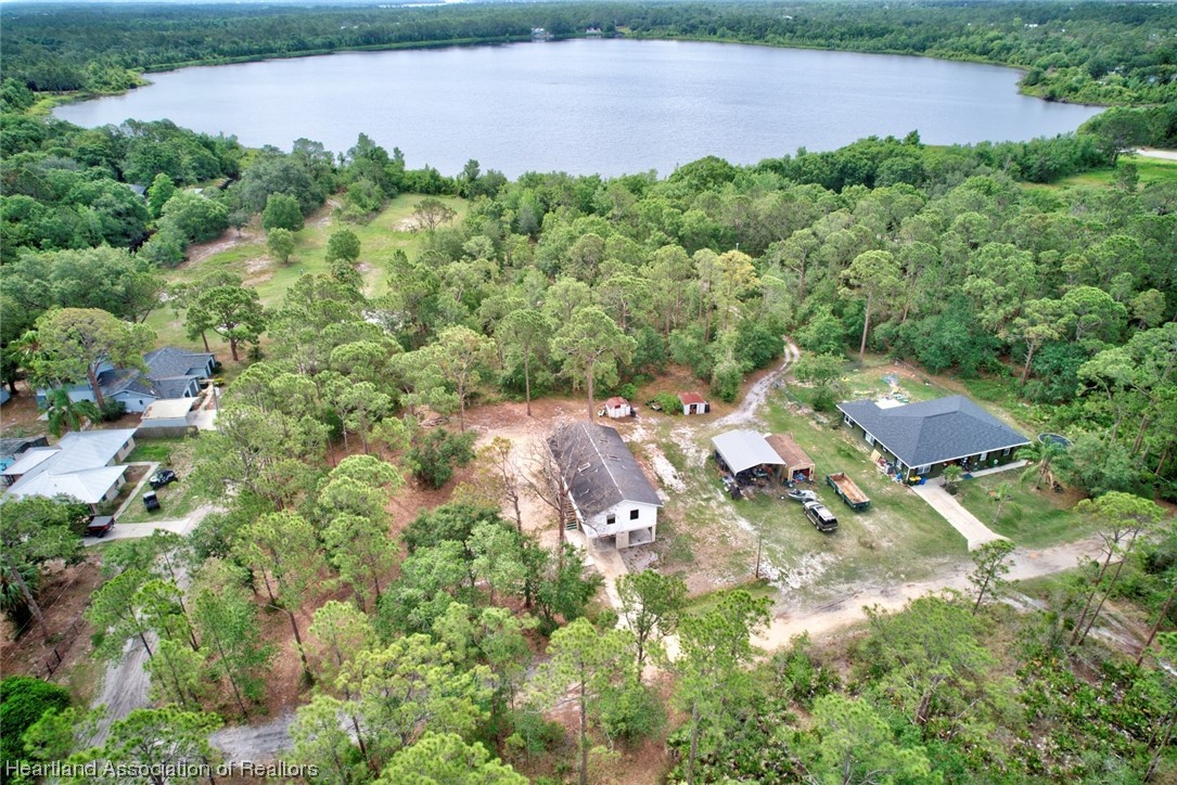 6304 Gunner Terrace Sebring, FL 33875 - Photo 41 of 41 an aerial view of residential house with outdoor space and trees all around
