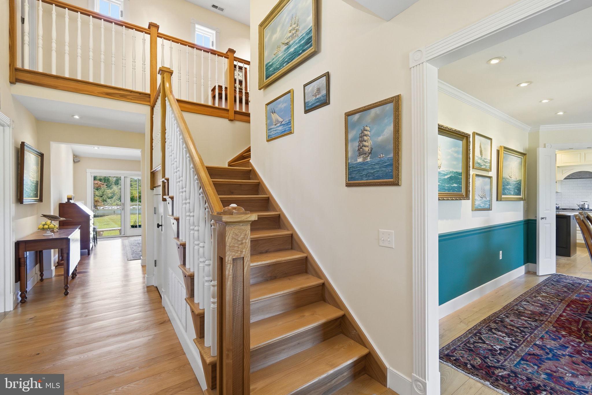 26226 Langs Landing Road Oxford, MD 21654 - Photo 9 of 48 a view of a hallway with furniture and staircase
