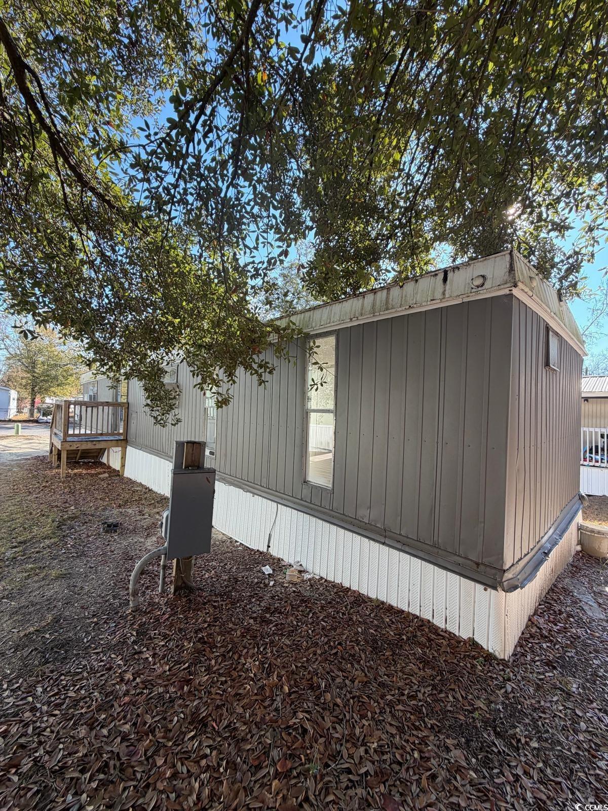 101 Dubbs Avenue West Columbia, SC 29169 - Photo 3 of 5 View of side of home featuring a wooden deck