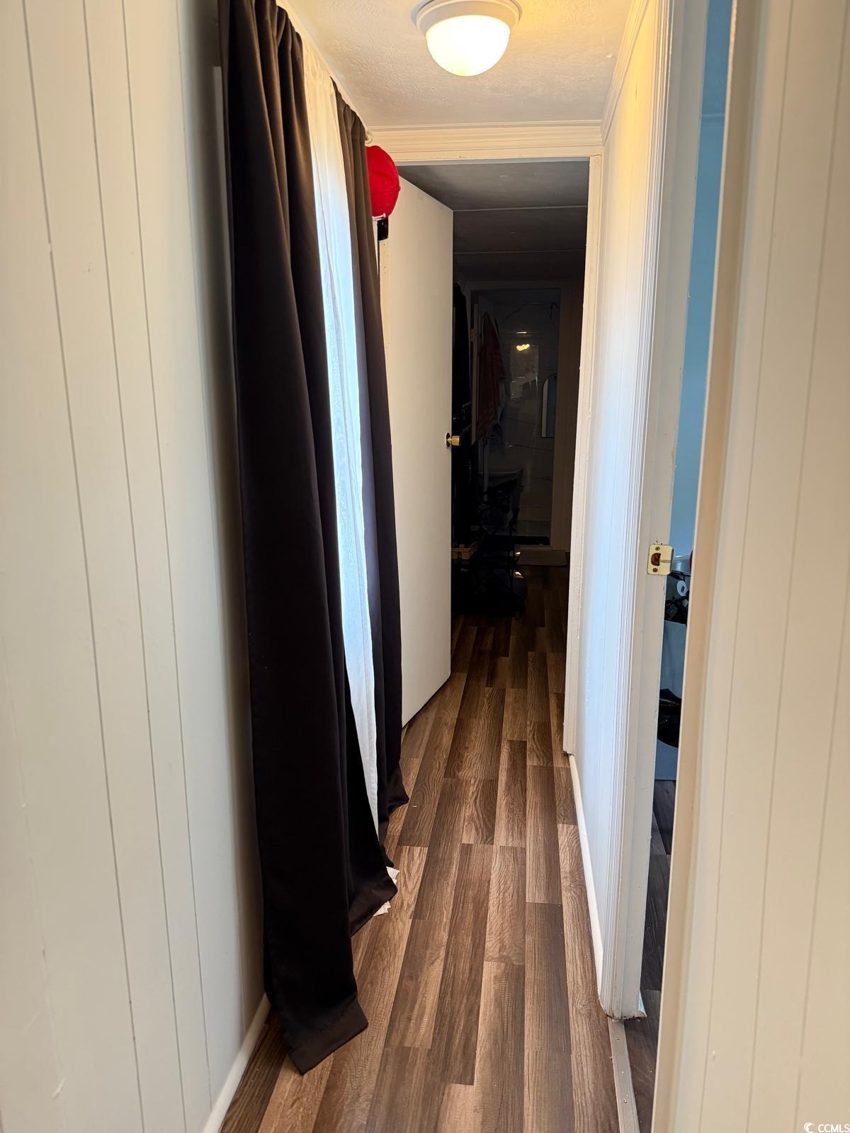 101 Dubbs Avenue West Columbia, SC 29169 - Photo 4 of 5 Hall featuring dark wood finished floors and wooden walls