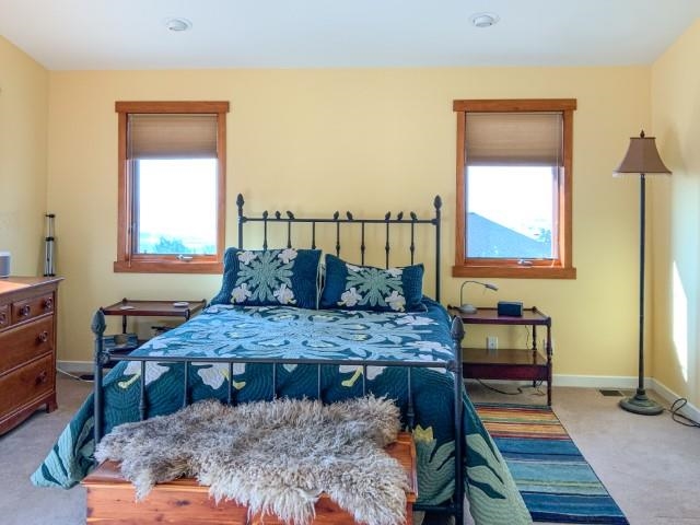 4958 Westridge Road Bishop, CA 93514 - Photo 13 of 24 a bed sitting in a bedroom next to a window