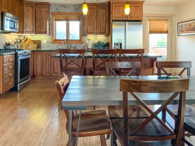 4958 Westridge Road Bishop, CA 93514 - Photo 5 of 24 a view of a dining room with furniture and wooden floor