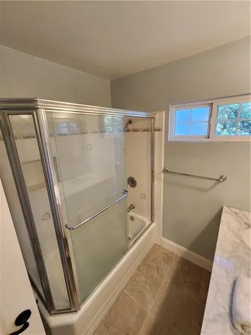 a bathroom with a shower and a toilet