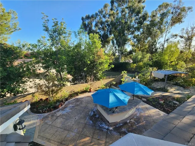 a view of backyard with seating space