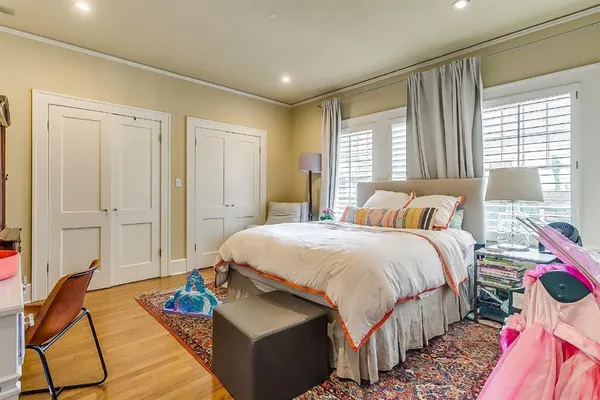 a bedroom with bed and window