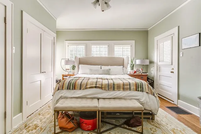 a bedroom with a bed and window