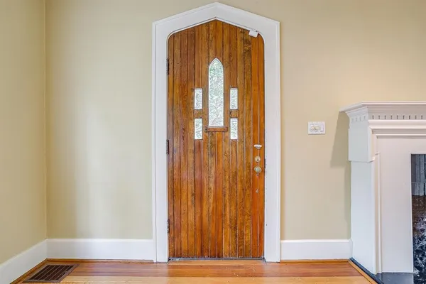 a view of entryway with wooden floor