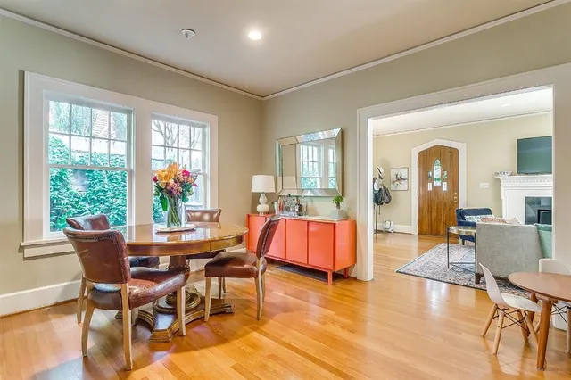 a view of a dining room with furniture window and wooden floor