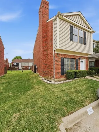 a view of an house with backyard space and garden