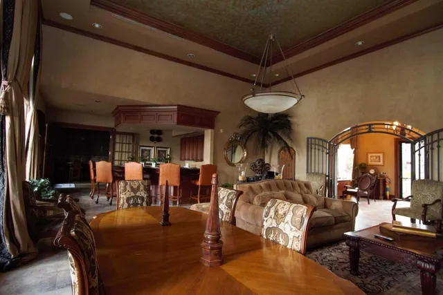 a living room with lots of furniture and white walls
