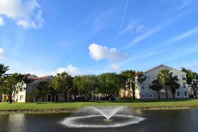 a view of a golf course with a lake view