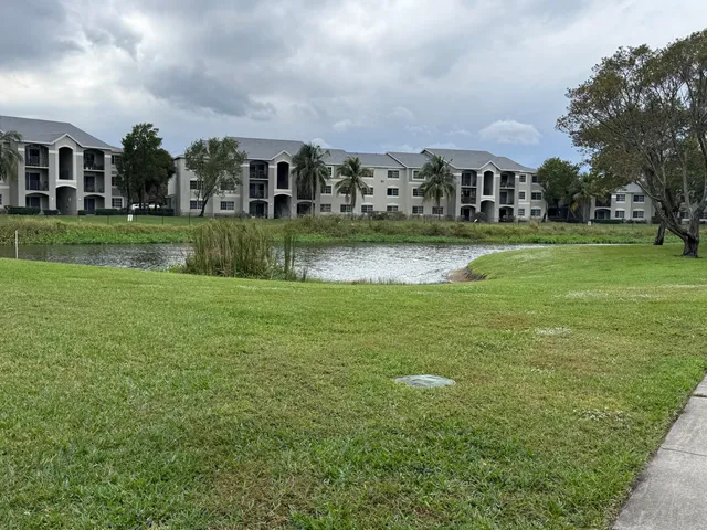 a view of house with a big yard
