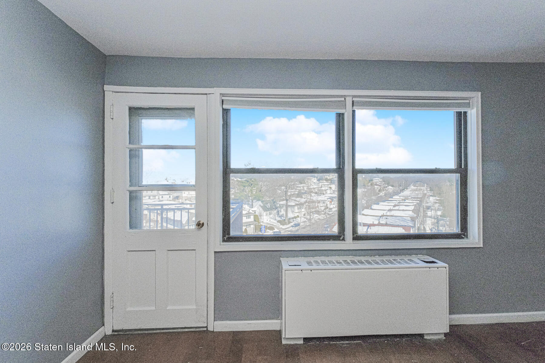 1000 Clove Road, Unit 7F Staten Island, NY 10301 - Photo 15 of 16 a living room with a large window