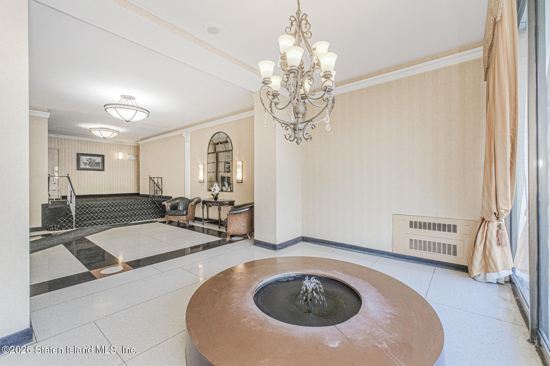 1000 Clove Road, Unit 7F Staten Island, NY 10301 - Photo 3 of 16 a view of a livingroom with furniture and chandelier