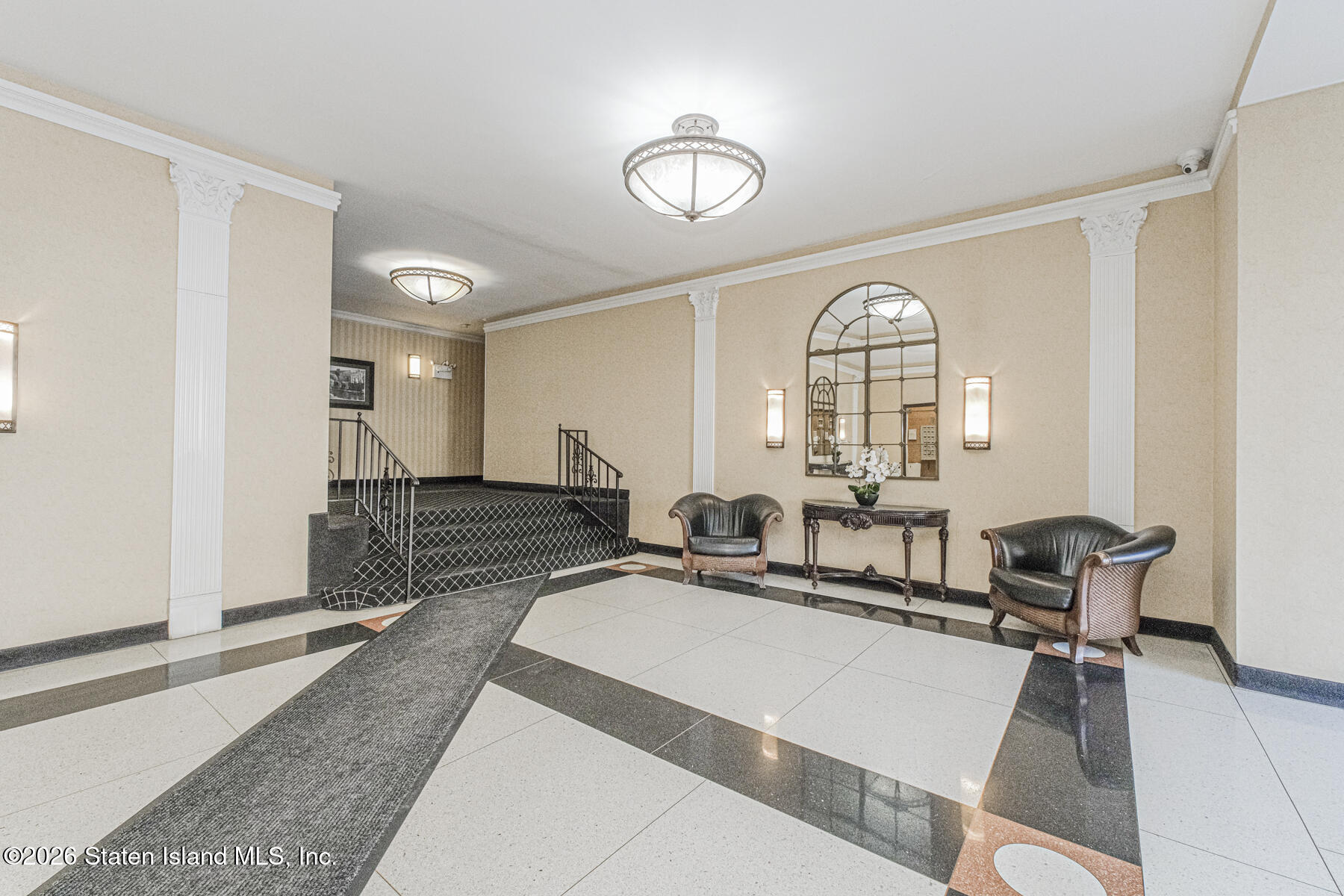 1000 Clove Road, Unit 7F Staten Island, NY 10301 - Photo 4 of 16 a living room with furniture a two sinks a table and a large mirror next to a window