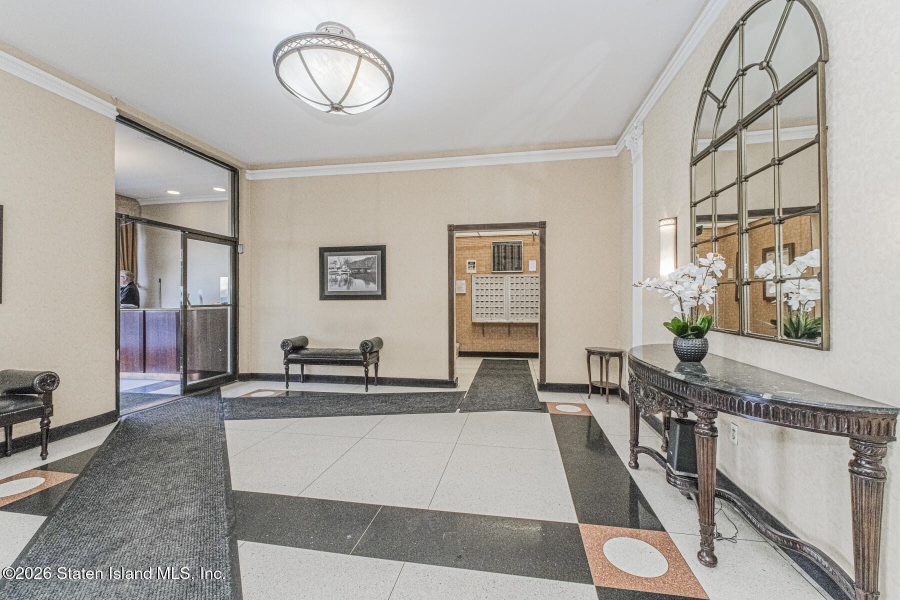1000 Clove Road, Unit 7F Staten Island, NY 10301 - Photo 5 of 16 a living room with furniture a flat screen tv and a window