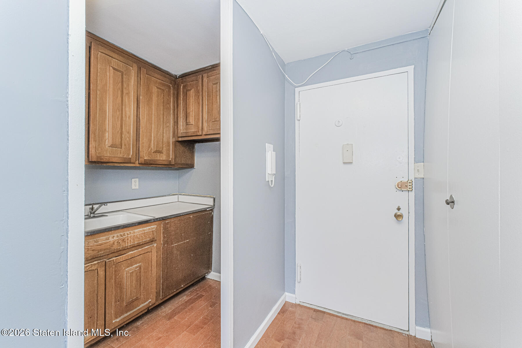1000 Clove Road, Unit 7F Staten Island, NY 10301 - Photo 9 of 16 a view of walk in closet with wooden floor