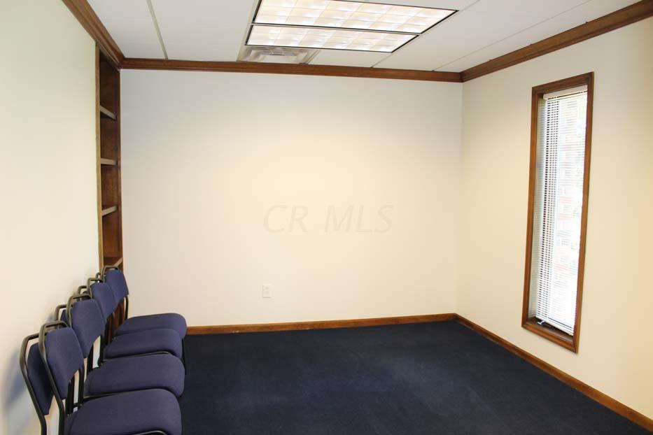 1900 Bethel Road Columbus, OH 43235 - Photo 19 of 24 New blue carpet ~02. Ivory painted walls. Suspended ceiling. Fluorescent lighting. Crown molding.