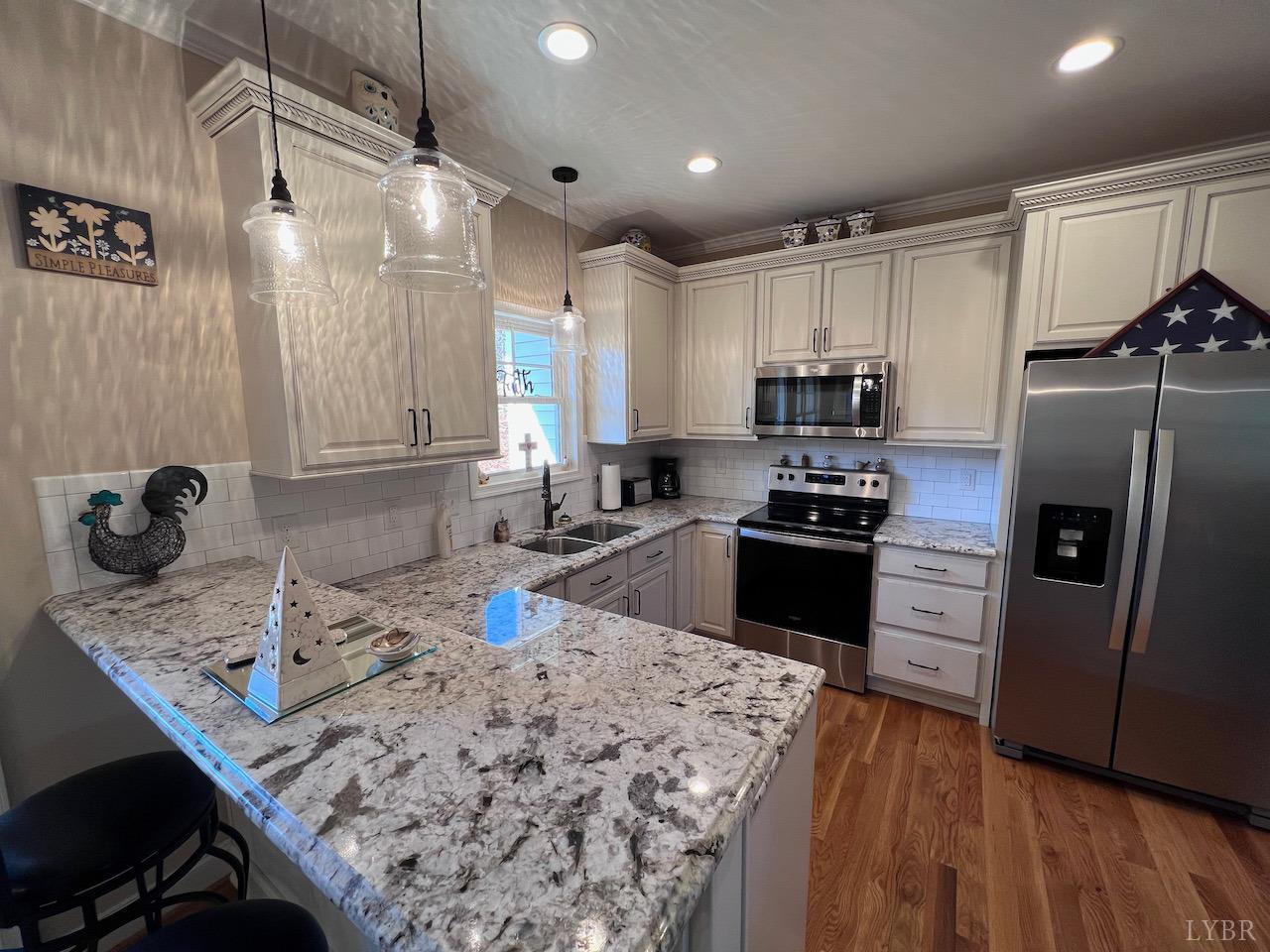 198 Oxford Furnace Road Lynchburg, VA 24504 - Photo 11 of 33 a kitchen with a refrigerator a stove a sink and a oven