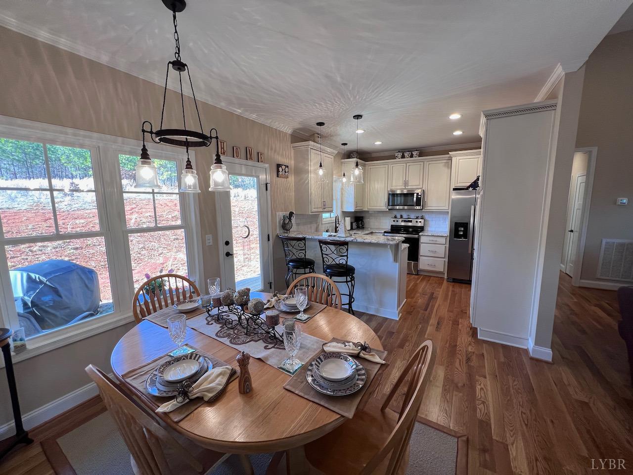 198 Oxford Furnace Road Lynchburg, VA 24504 - Photo 14 of 33 a view of a dining room with furniture large window and wooden floor