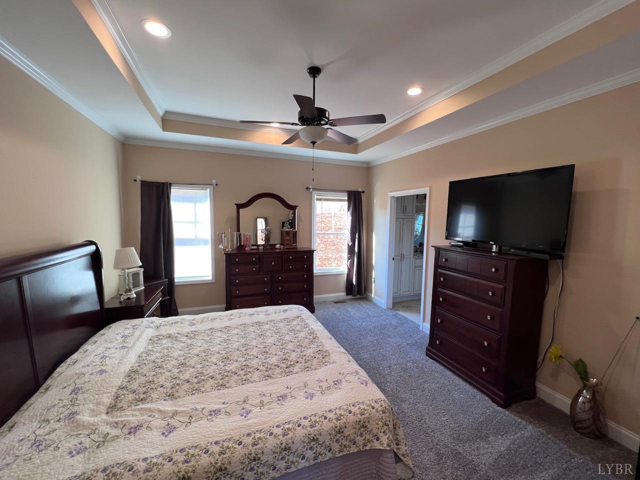 198 Oxford Furnace Road Lynchburg, VA 24504 - Photo 20 of 33 a bedroom with a bed and a flat screen tv in it