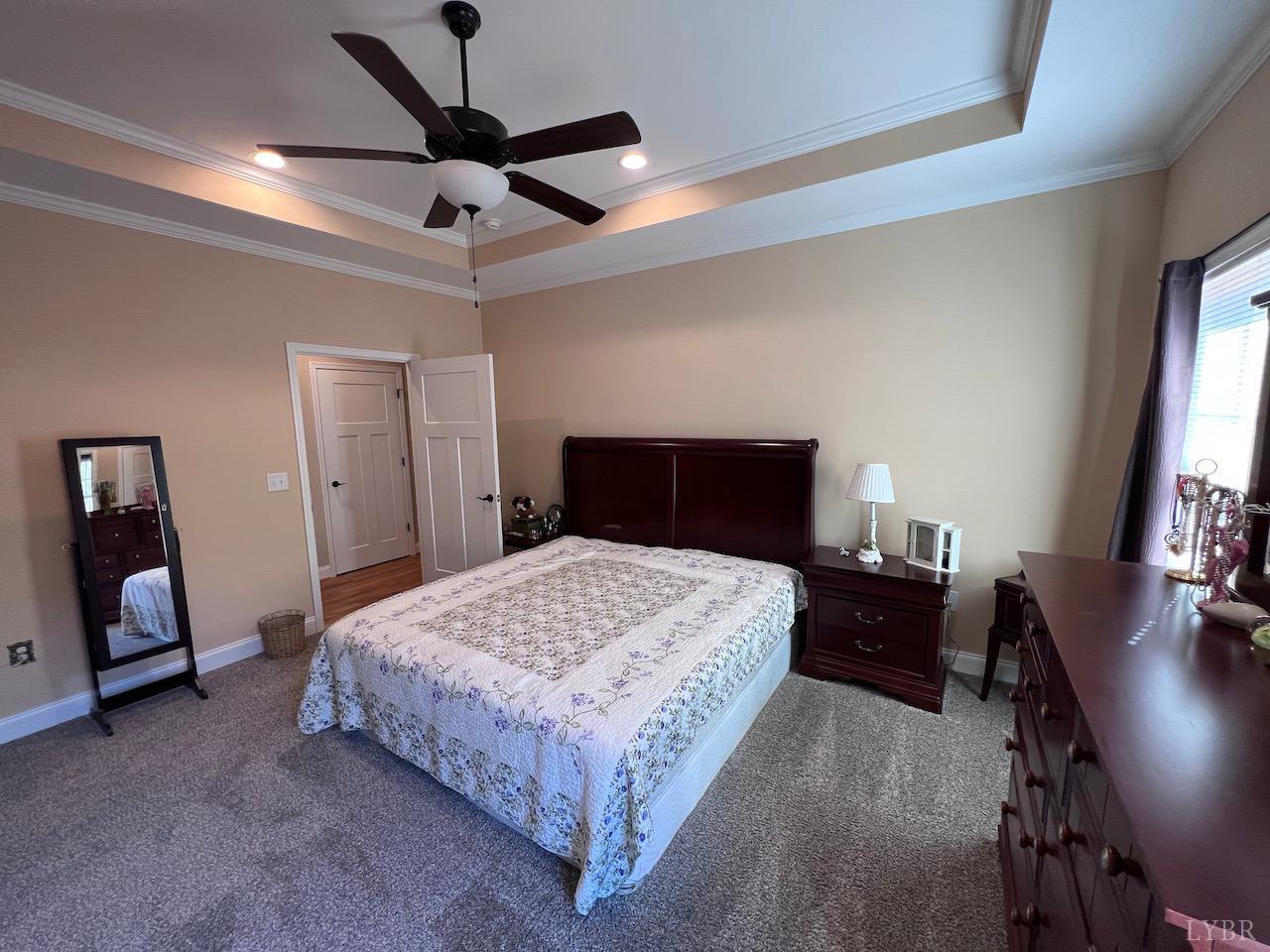 198 Oxford Furnace Road Lynchburg, VA 24504 - Photo 21 of 33 a bedroom with a bed and dresser with mirror