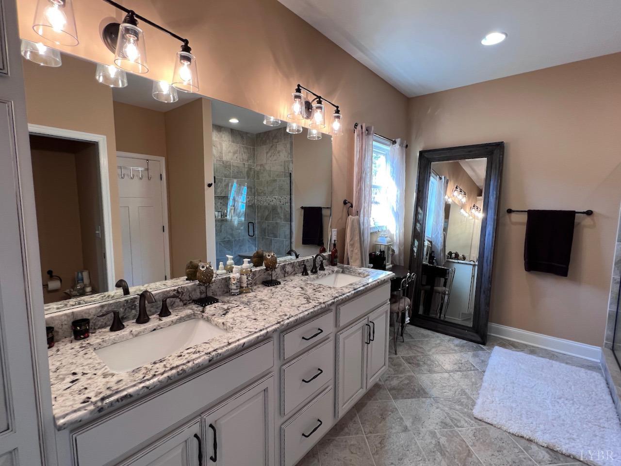 198 Oxford Furnace Road Lynchburg, VA 24504 - Photo 22 of 33 a bathroom with a double vanity sink and a mirror