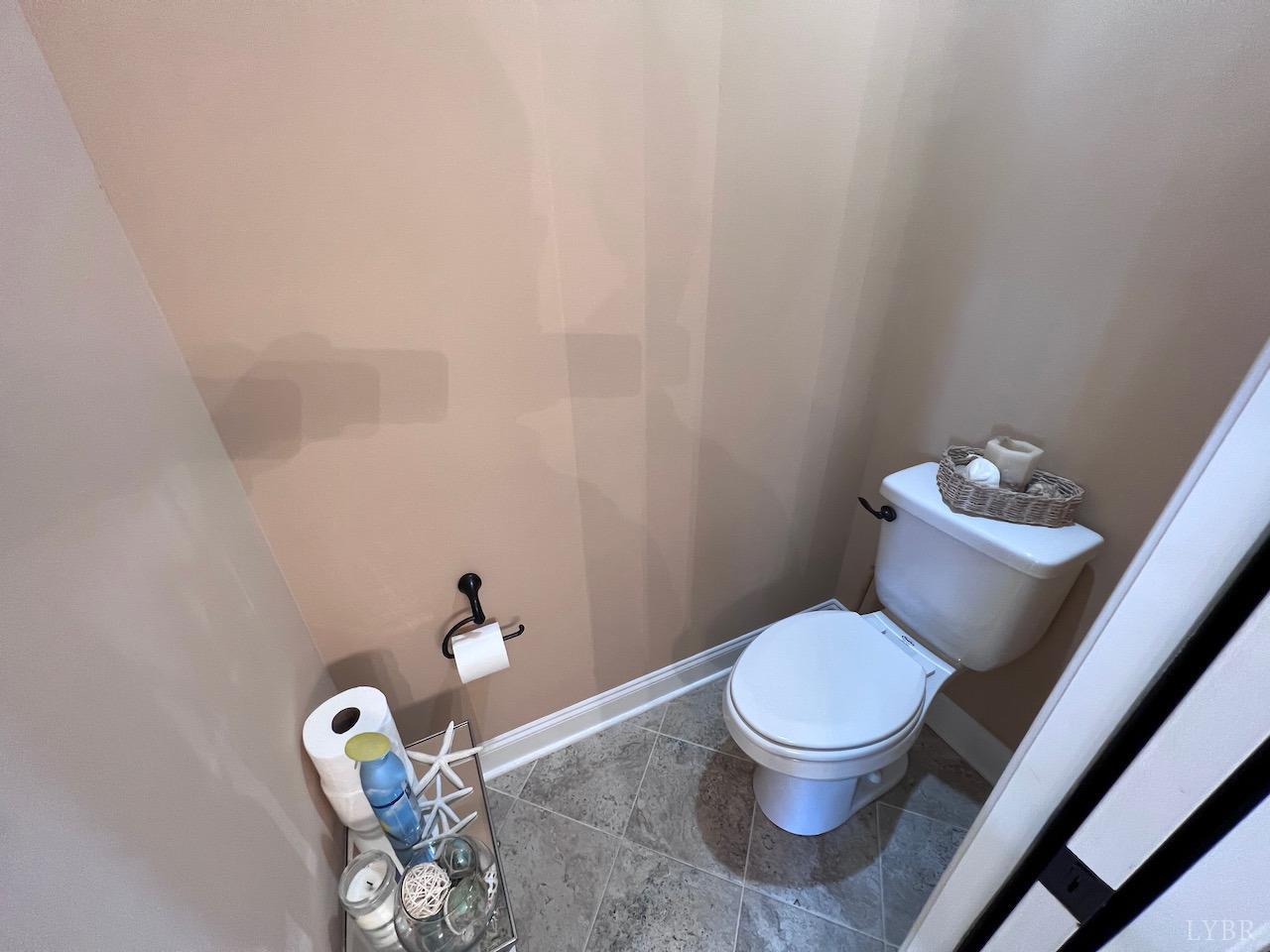 198 Oxford Furnace Road Lynchburg, VA 24504 - Photo 24 of 33 a white toilet sitting next to a bathroom sink