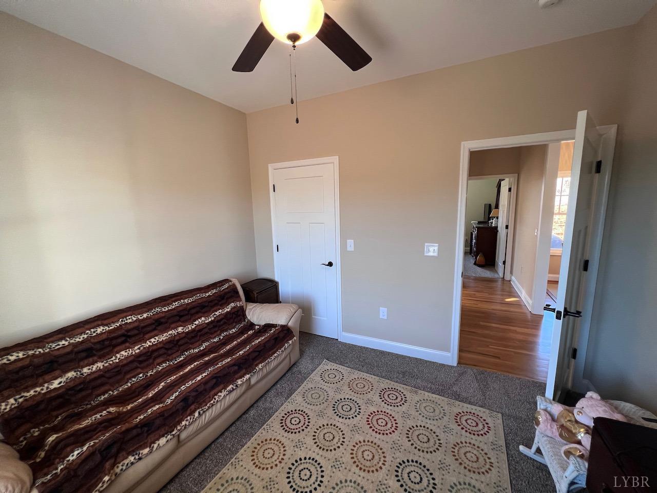 198 Oxford Furnace Road Lynchburg, VA 24504 - Photo 28 of 33 a bedroom with wooden floor a ceiling fan and a bathtub