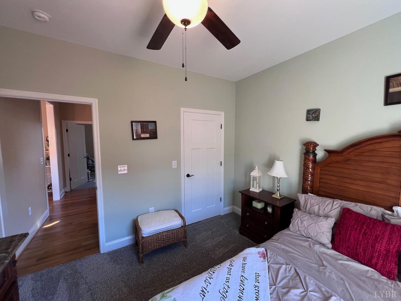 198 Oxford Furnace Road Lynchburg, VA 24504 - Photo 31 of 33 a bedroom with a bed and wooden floor