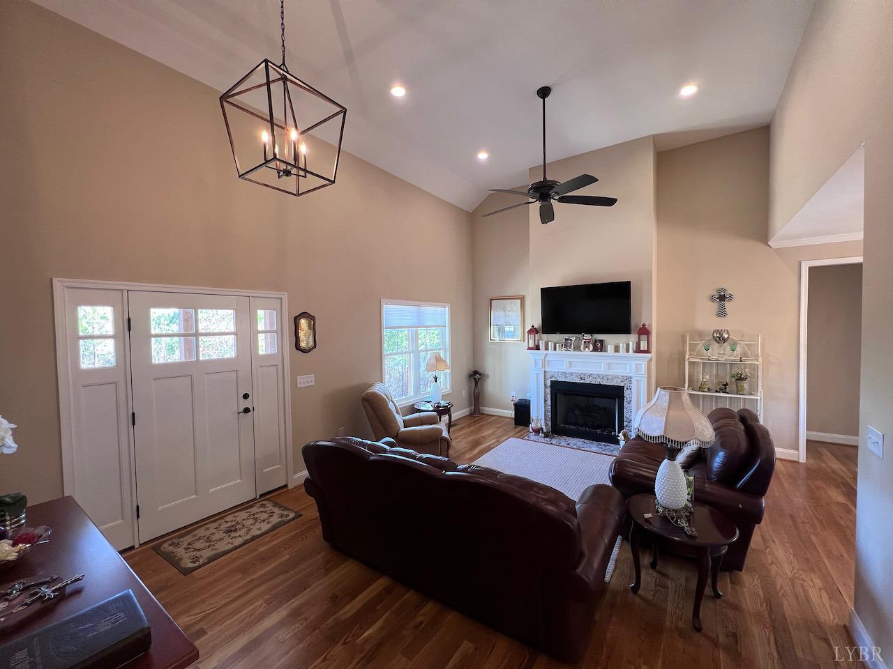 198 Oxford Furnace Road Lynchburg, VA 24504 - Photo 7 of 33 a living room with furniture a fireplace and a flat screen tv