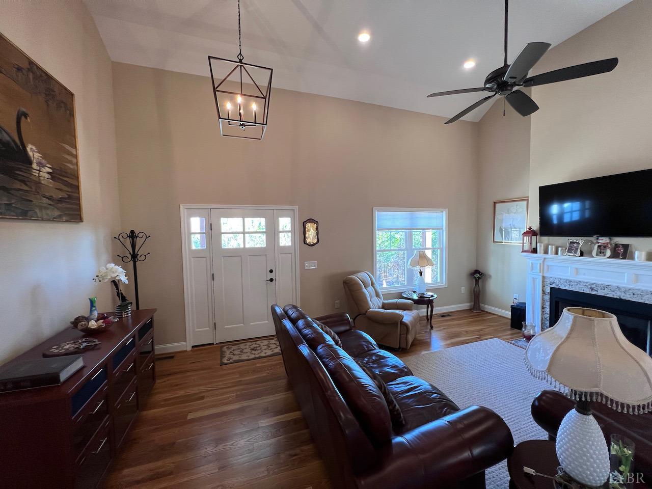 198 Oxford Furnace Road Lynchburg, VA 24504 - Photo 8 of 33 a living room with furniture a flat screen tv and a fireplace