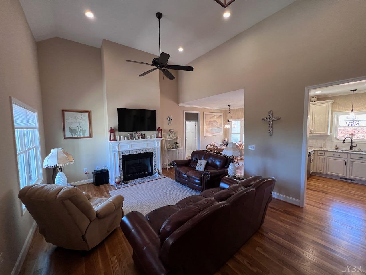 198 Oxford Furnace Road Lynchburg, VA 24504 - Photo 9 of 33 a living room with furniture a fireplace and a flat screen tv