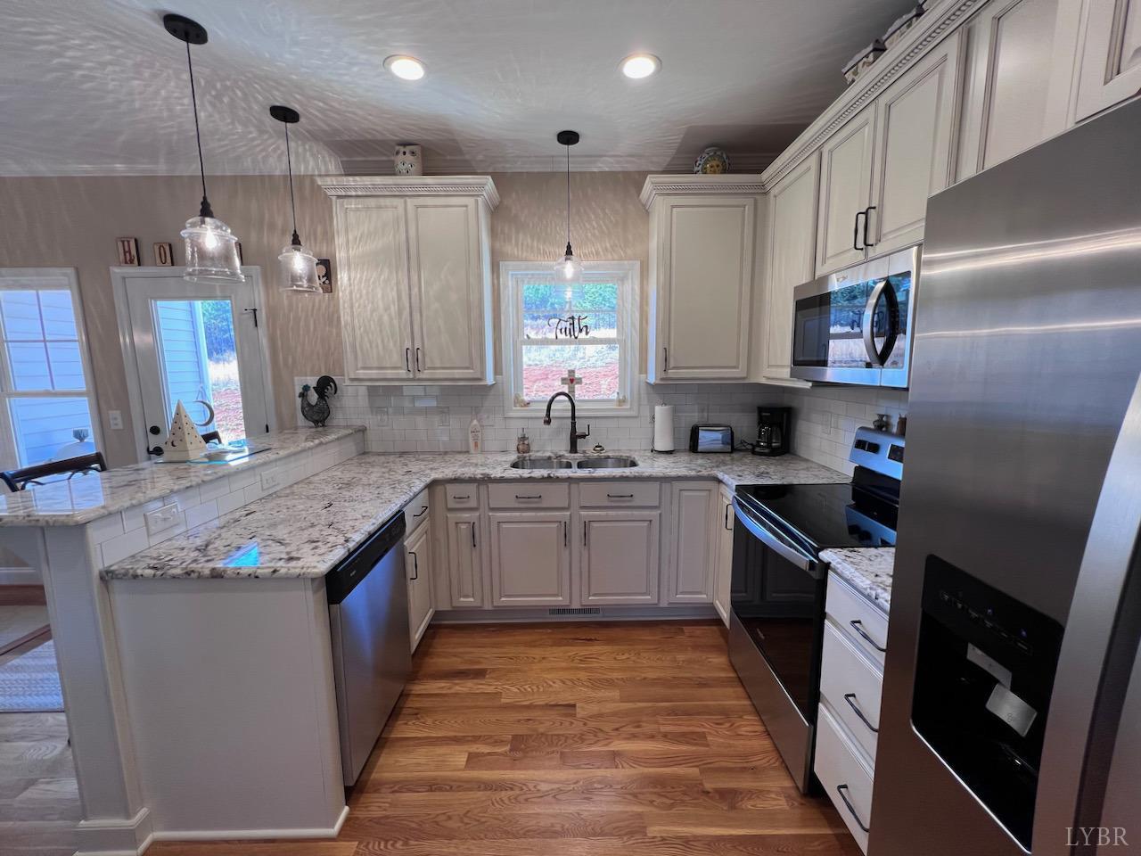 198 Oxford Furnace Road Lynchburg, VA 24504 - Photo 10 of 33 a kitchen with stainless steel appliances granite countertop a sink stove and refrigerator
