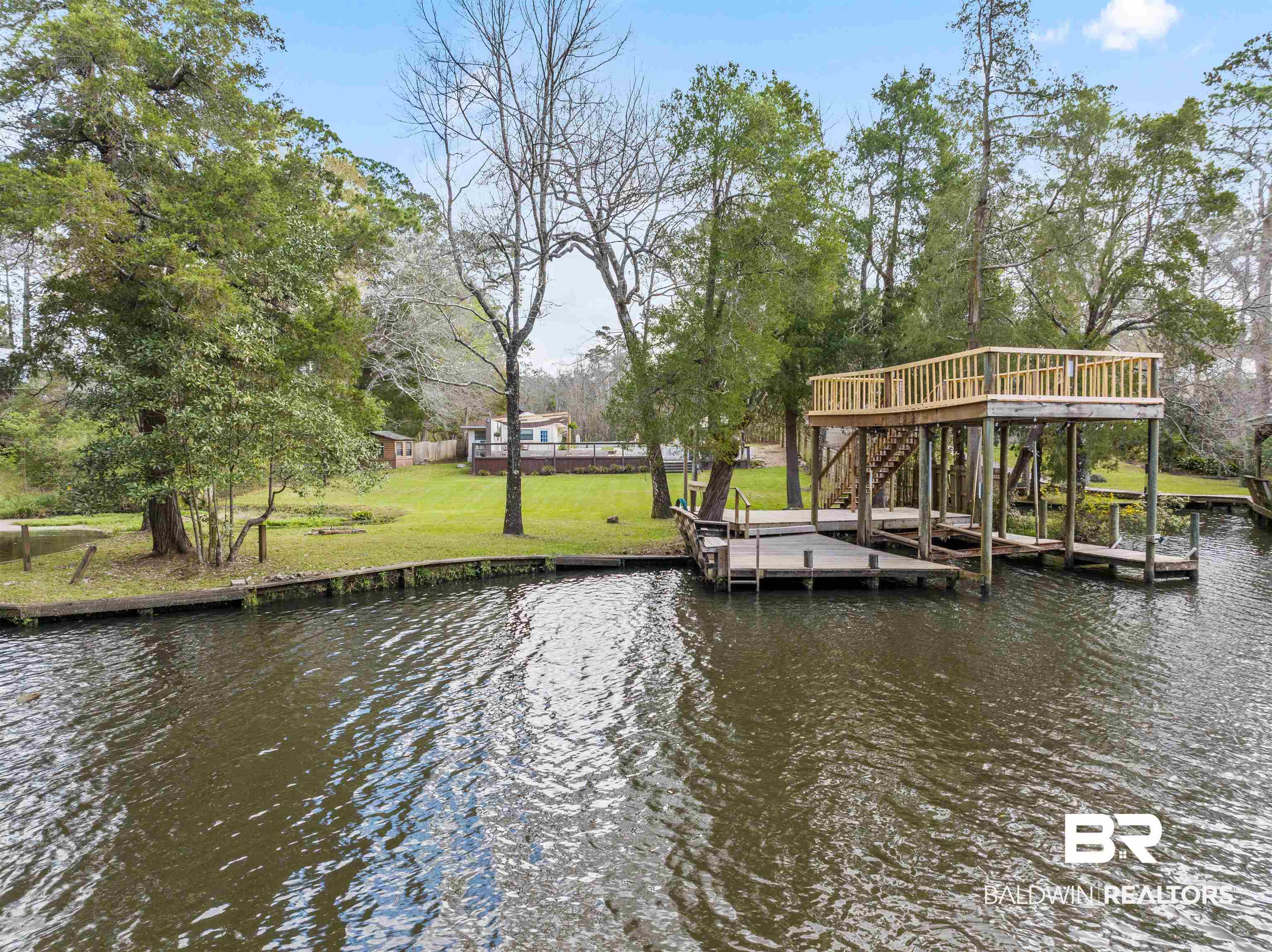 17595 River Road Summerdale, AL 36580 - Photo 1 of 29 Dock featuring a water view, a lawn, and boat lift