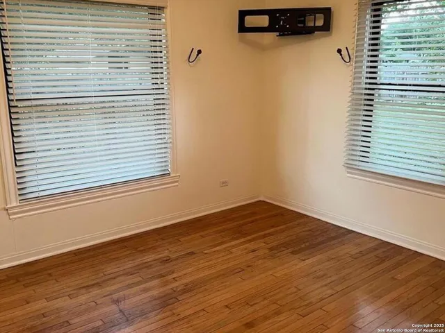 a view of a room that has a window in it