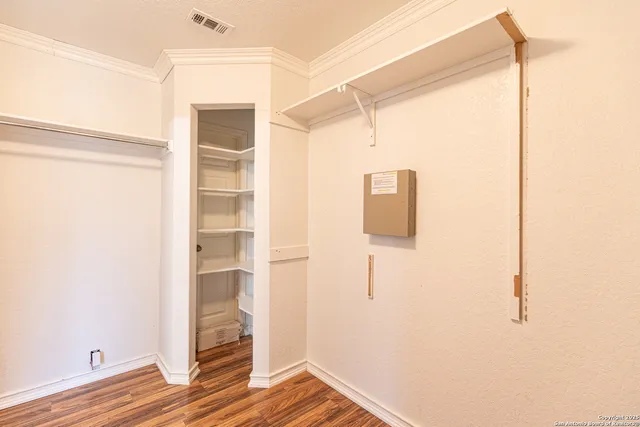 a view of front door and wooden floor