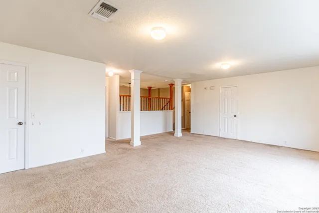 an empty room with closet area