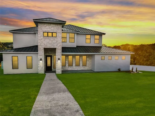 a front view of a house with a yard